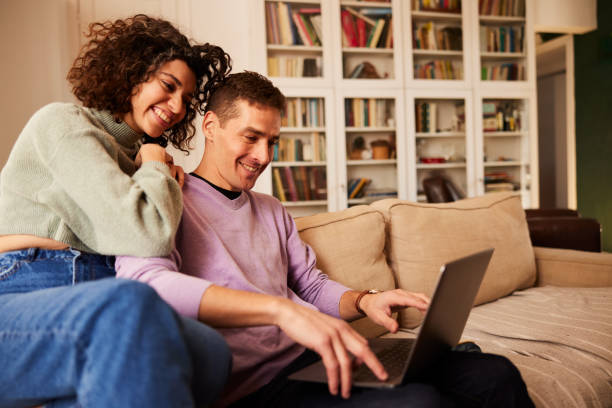 istock Couple Juggles Work and Relaxation at Home 1460749338