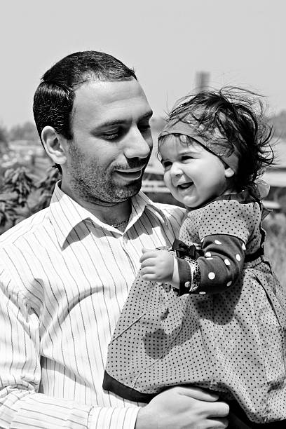 istock happy father with baby in black and white 146075518