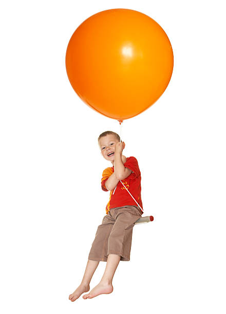 istock The boy flies on balloons 146075625