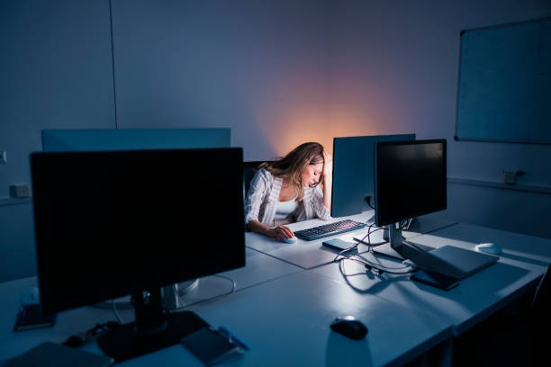 istock Woman anxious while working late in an office 1460756375