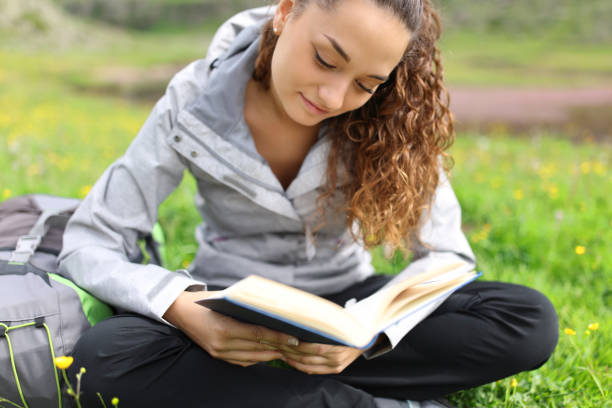 istock Hiker reading a paper book 1460756906