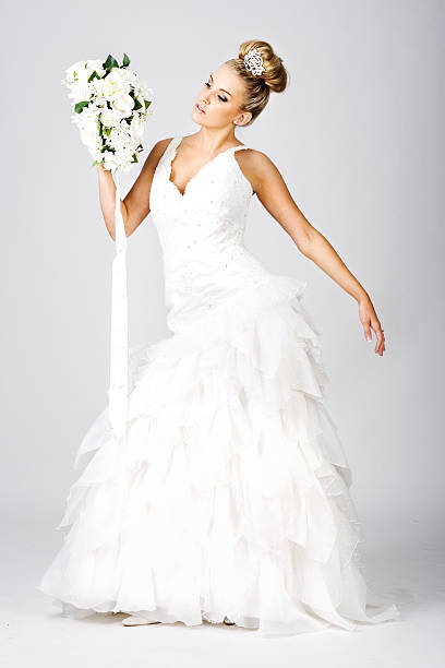 istock Happy young bride with bouquet on white 146075859