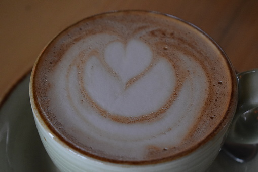Froth with hearts and delicious coffee