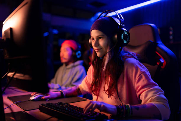 istock Smiling woman playing massively multiplayer online game over PC. 1460760541