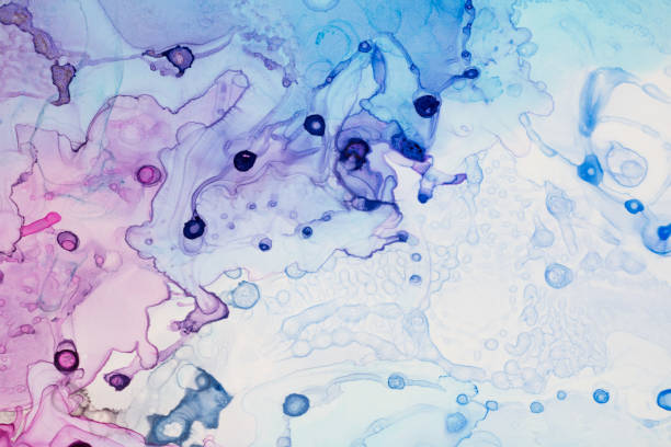 istock Blue pink and purple ink drops and splotches background 1460761856