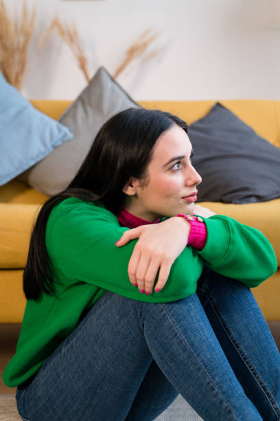istock young woman looking away at home 1460769561