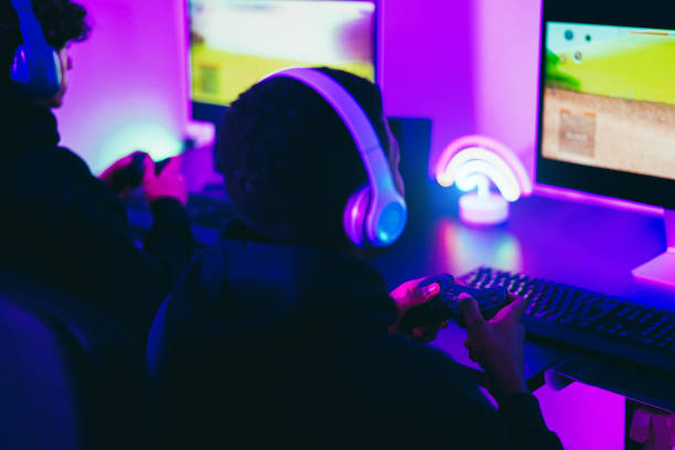 istock Young gamers playing e-sports competition using vr headset - New technology game trends and entertainment concept 1460771160