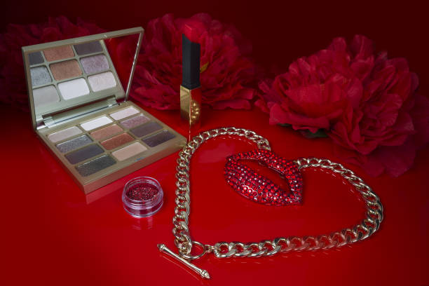 istock Cosmetics on a red background. There are lipstick, eyeshadow, powder, blush, eyeliner, 1460772267