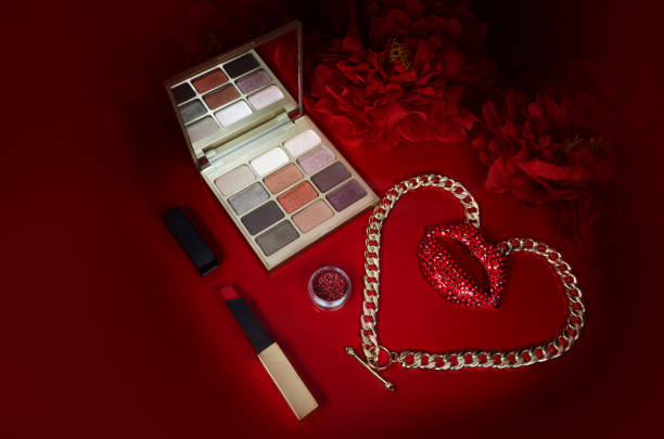 istock Cosmetics on a red background. There are lipstick, eyeshadow, powder, blush, eyeliner, 1460772310