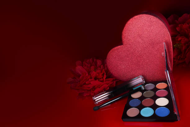 istock Cosmetics on a red background. There are lipstick, eyeshadow, powder, blush, eyeliner, 1460772409
