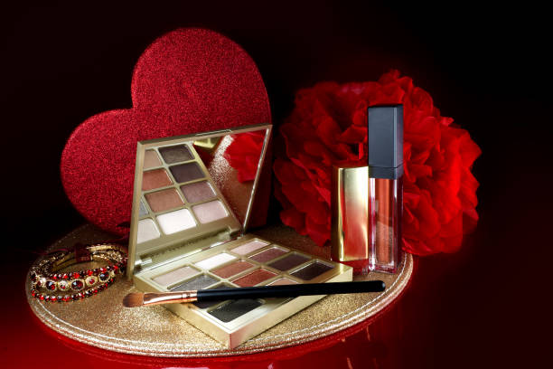istock Cosmetics on a red background. There are lipstick, eyeshadow, powder, blush, eyeliner, 1460772434