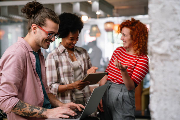 istock Group of young happy creative team, multicultural coworkers working in office together 1460772541