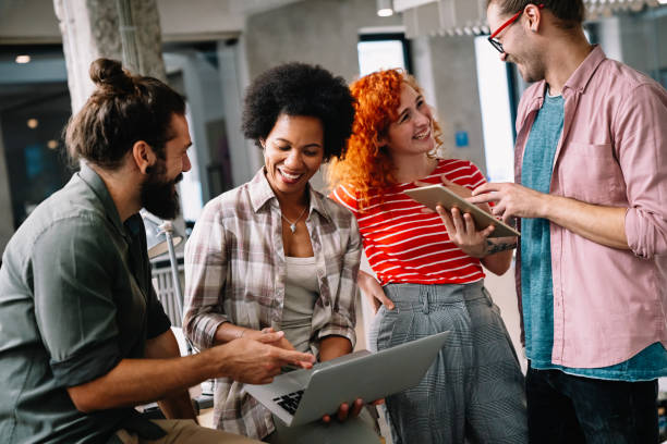 istock Young startup business people having fun, working and chatting at workplace office 1460773205