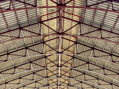 Low angle view of warehouse metallic ceiling structure