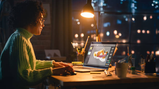 istock Latina Female Designer Working on Laptop, Screen Showing Editing Software with 3D Model of a Shoe. Concentrated Woman Creating Her Own Project, Using Modelling Technology on Computer. 1460774133