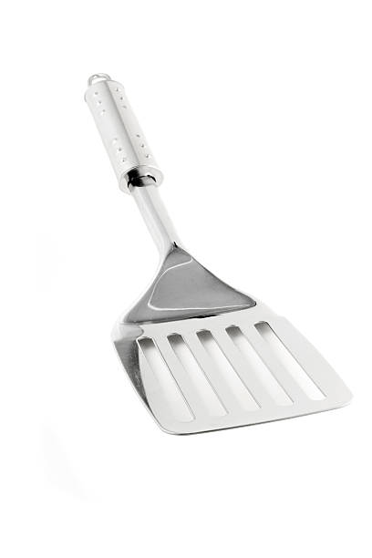 istock Kitchen utensil - stainless spatula isolated on white 146077486