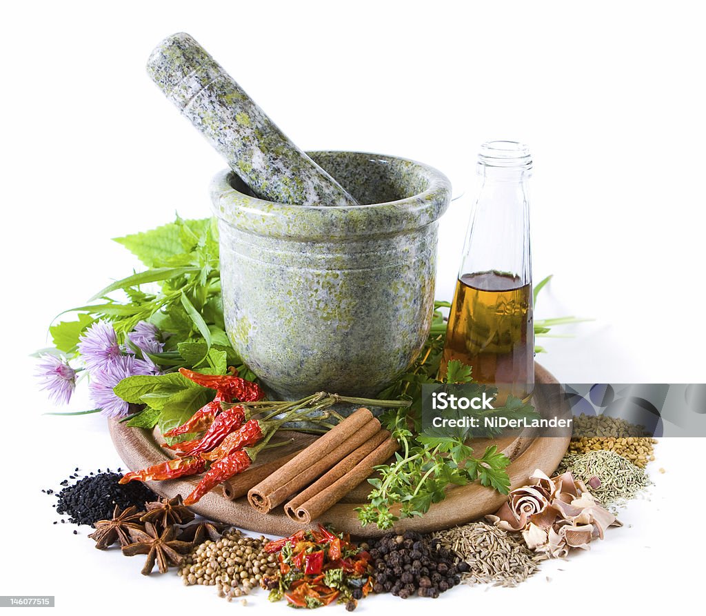 Herbs and spices Herbs and spices with mortar and bottle with oil Cooking Oil Stock Photo