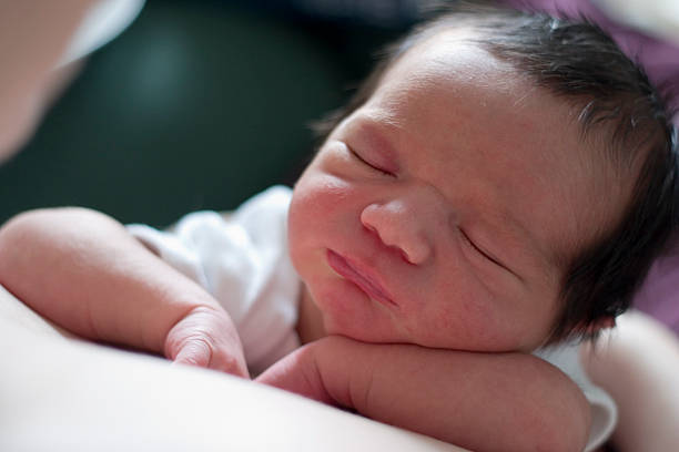 istock new born laying on his Mothers chest in hospital 146077607