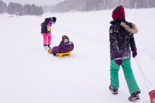 Kids having fun in a snow. Winter activities