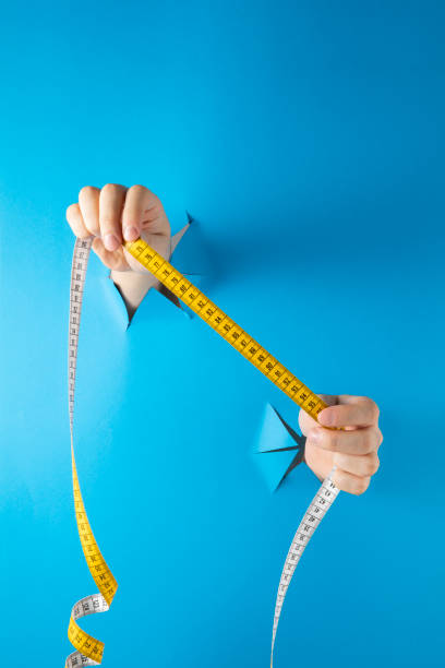 istock Hands with Tape Measure 1460777294