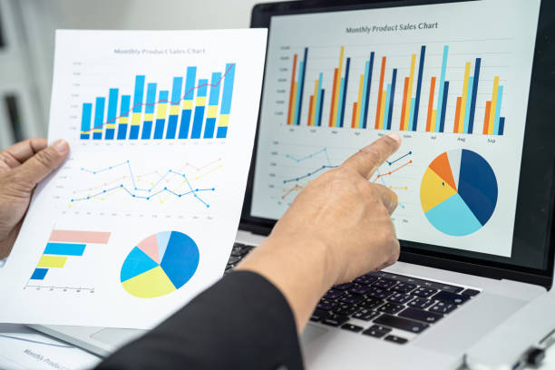 istock Asian accountant working and analyzing financial reports project accounting with chart graph and calculator in modern office, finance and business concept. 1460779852