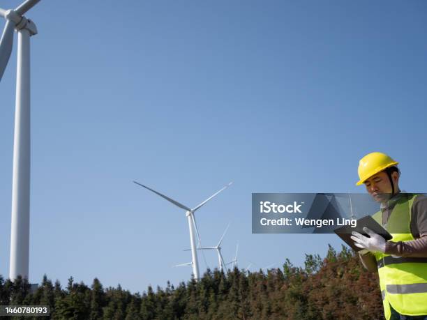 Engineer Inspects Generator Stock Photo - Download Image Now - Environmental Conservation, Technology, 30-34 Years