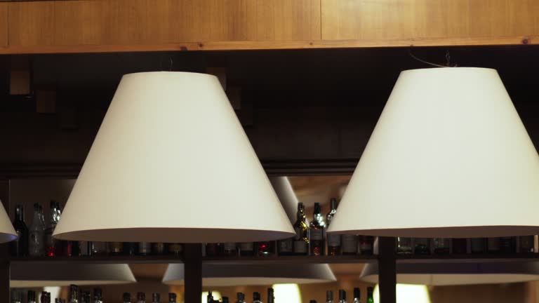 Vintage lamps over a wooden table in a bar