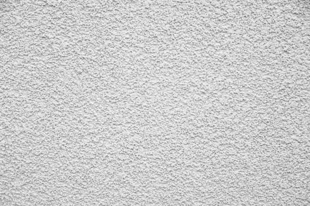 textura de la pared de yeso blanco como fondo - rough cast fotografías e imágenes de stock
