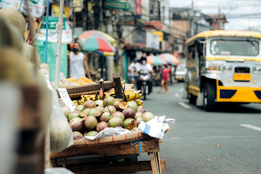 fruit stand with mangoes on a sidewalk in Manila, Philippines