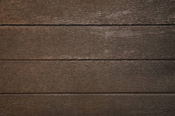 istock Texture of dark brown wooden surface as background 1460783273