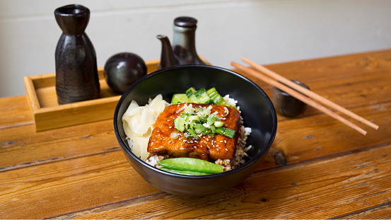 Salmon cooked with teriyaki sauce. Traditional Japanese recipe.