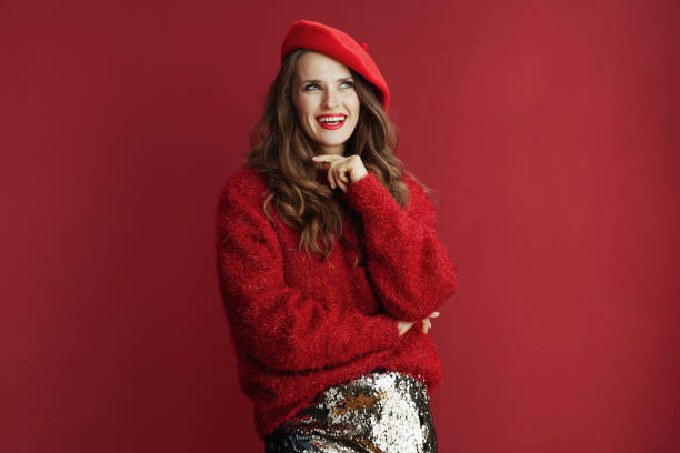 istock smiling modern woman in red sweater and beret 1460783967