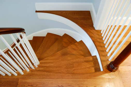 Polished, hardwood steps on luxury home interior showing dynamic pattern and quality carpentry