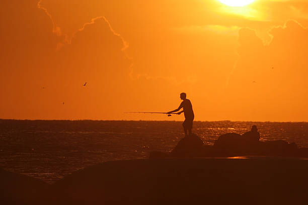 Sunset fishing stock photo