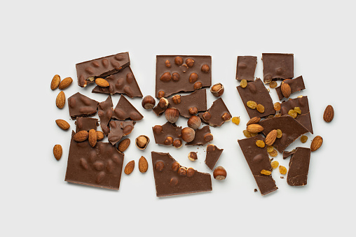 milk chocolate with nuts on a white background