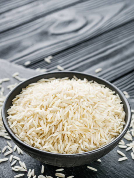 istock raw basmati rice on a black wooden background 1460785671