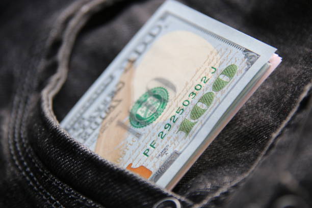 istock American dollars USD banknotes in jeans pocket. 1460786560