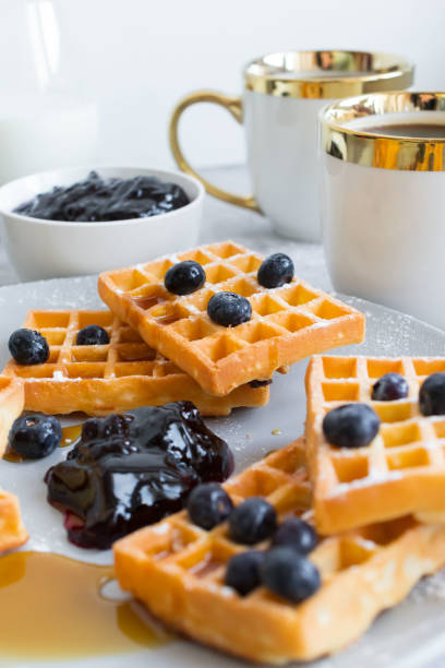 istock Homemade waffles with berries in a plate. 1460788216