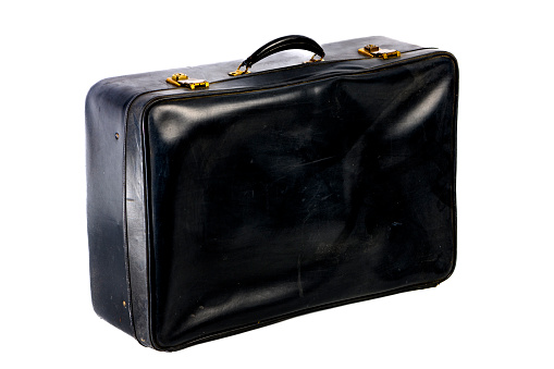 Old fashioned leather suitcase for traveling studio shot isolated on a white background.