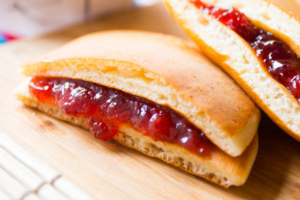 Dorayaki is a type of Japanese sweet that consists of two round-shaped cakes filled with anko, which is a bean paste made with azuki bean variant.