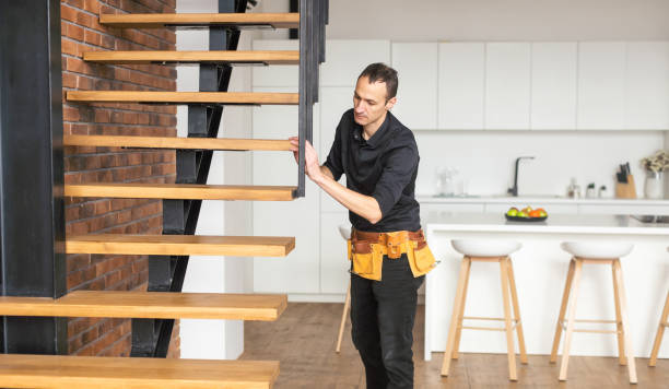 the worker is repairing the stairs