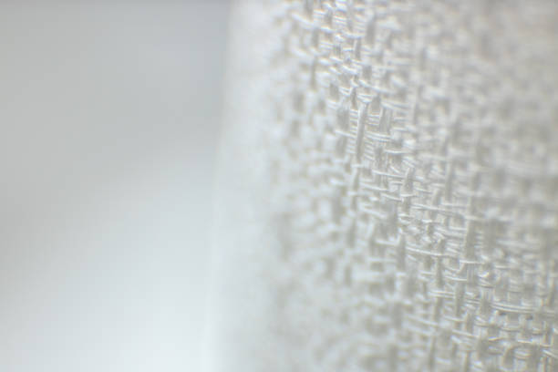 istock Textured background made with fabric mesh picked up in detail, close up and copy space. 1460793074