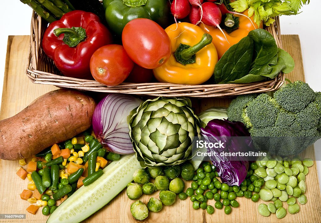 Vegetable basket A basket overflowing with delicious fresh vegetables Artichoke Stock Photo