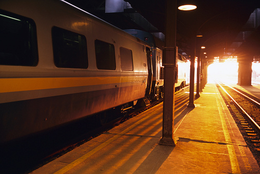 A train on the platform at sunset