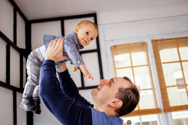 Man have fun with his son at home