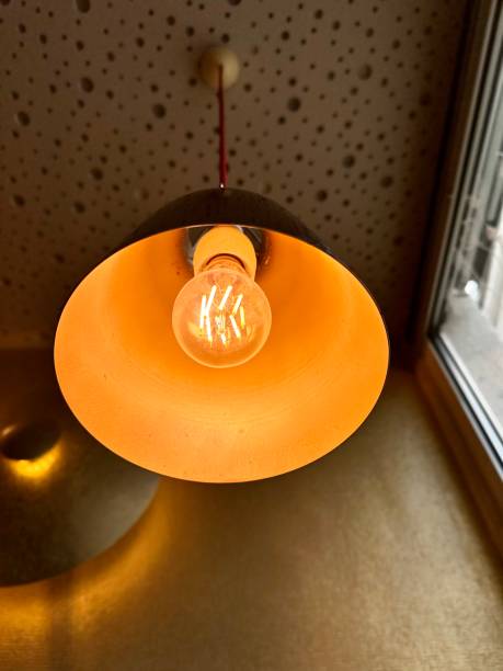Hanging light with a single bulb in the room
