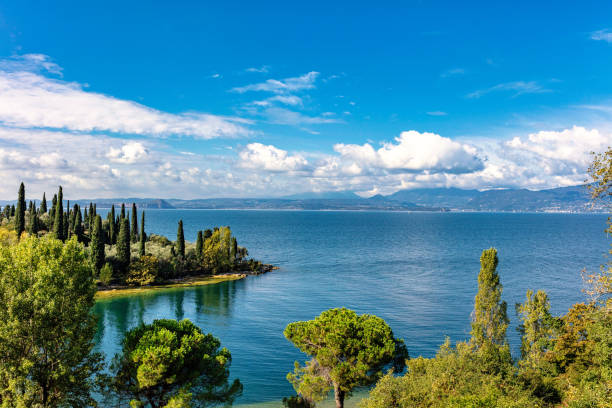 autumn view over of lake garda in italy, europe - reflection imagens e fotografias de stock