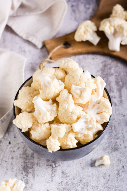 istock Fresh raw cauliflower in a bowl on the table. Natural antioxidant. Vertical view 1460796839