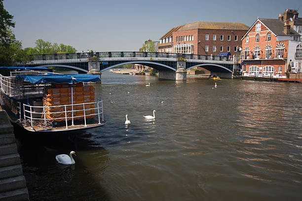 Windsor Bridge The pedestrian bridge between Eton and Windsor on a beautiful sunny day. thames valley stock pictures, royalty-free photos & images