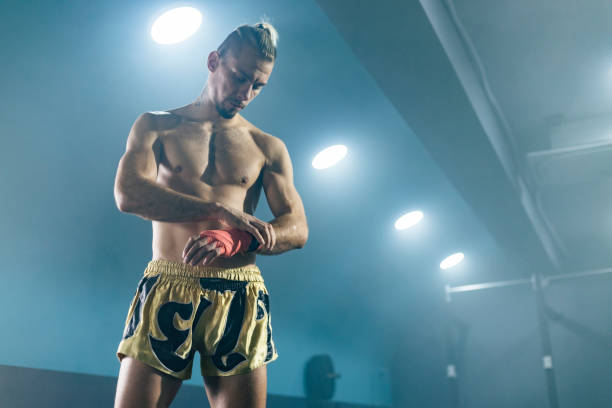 istock Muay Thai boxer preparing bandages for training. 1460796995